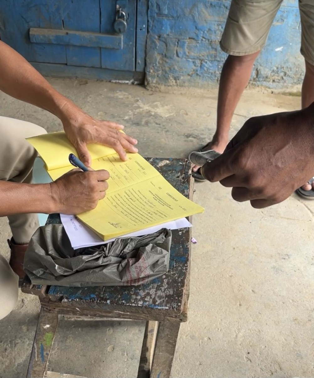 Traffic personnel record a fine during a surprise checking drive in Wokha town on September 30. (Morung Photo)